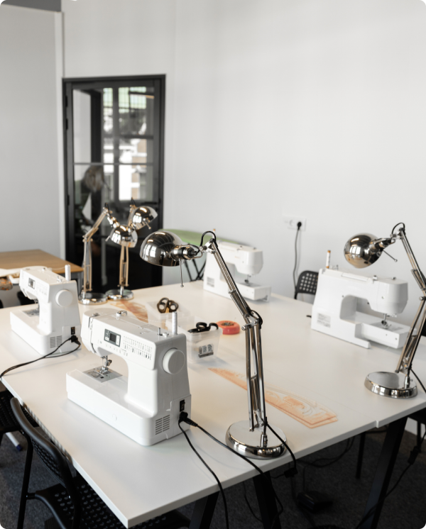Sewing studio with lamps and machines